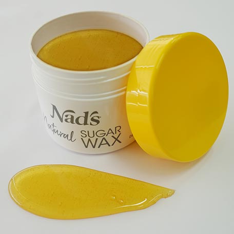 Nad's Natural Sugar Wax | Best at Home Hair Removal Methods for 2020 Nad's Natural Sugar Wax open container with wax poured out